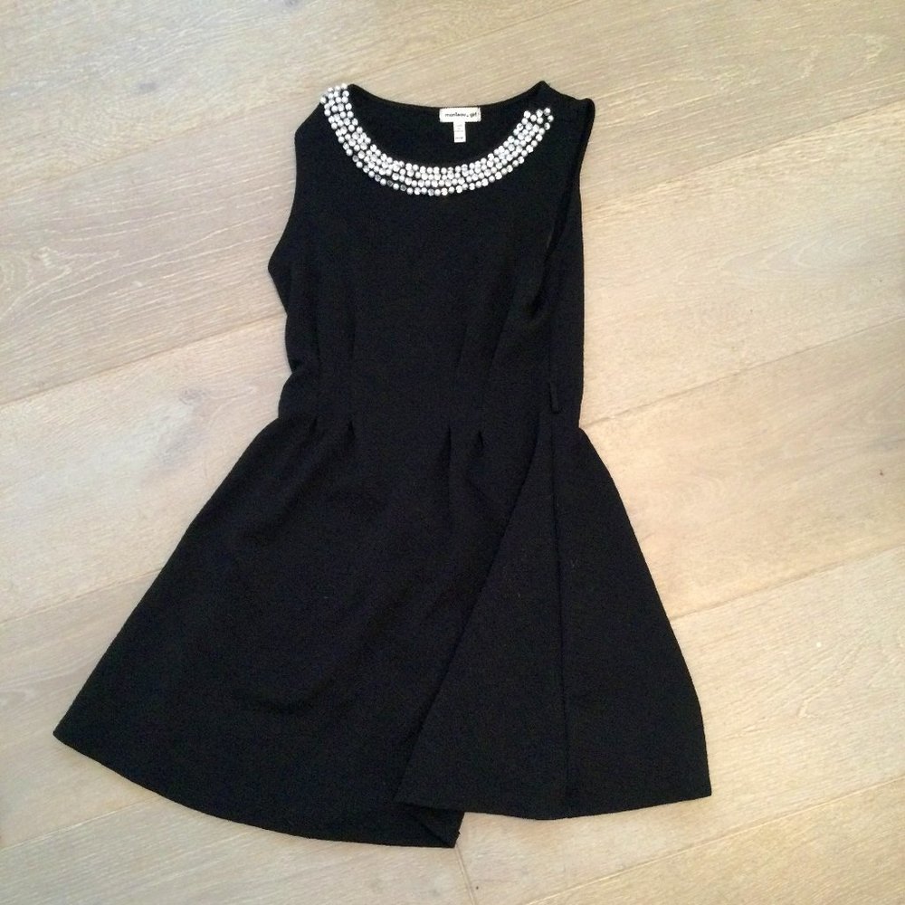 Black dress with a pearl neck line